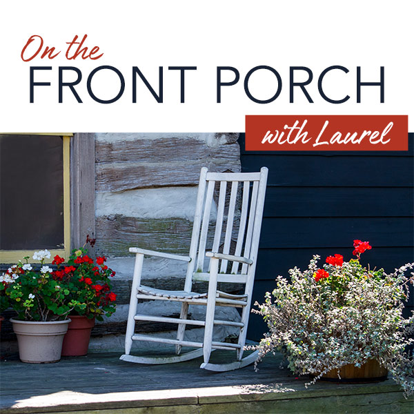 Front porch with white wooden rocking chair